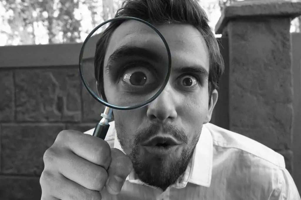 1 a man with a magnifying glass