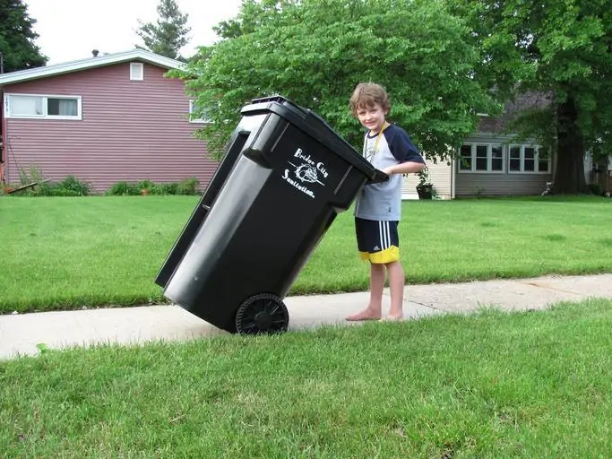 6 a child with a trash can